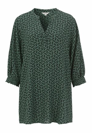 Grön blus med bladmönster, med V-ringning, smockade ärmar och en lös passform. Tillverkad av lättviktigt tyg.