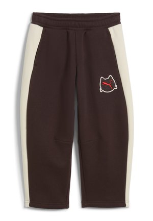 Brune joggingbukser med cremefarvede sidelister og et katteansigtslogo med et rødt Puma-symbol på venstre ben.