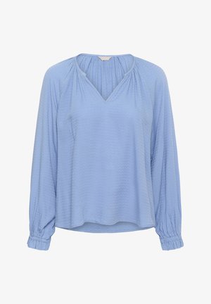 Svetlomodrá blúzka s dlhým rukávom a výstrihom do V, s textúrovanými, zigzagovými vzormi a gumenými rukávmi na zápästiach. Mäkká, splývavá látka.