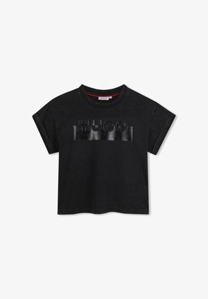 Zwarte oversized t-shirt gemaakt van katoen, met een glanzend zwart "HUGO" logo op de voorkant. Ronde halslijn met korte, opgerolde mouwen.