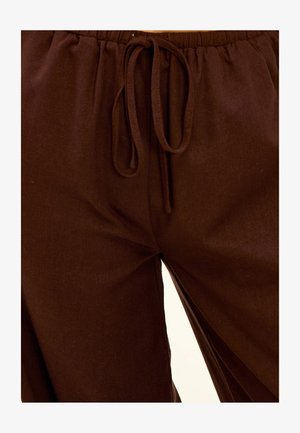 Brown, lightweight, elastic waistband pants with a drawstring closure and a smooth, linen-like texture. Features side seams.