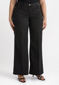 Black wide-leg pants made of lightweight fabric, featuring a front button closure, two side pockets, and a smooth texture.