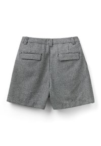 Schackrutigt mönstrade byxor i svart och vitt med rak ben design, med två bakfickor och en platt midjeband.