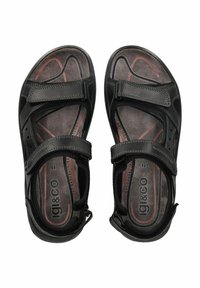 Czarne sandały z regulowanymi paskami, teksturowaną wkładką i lekką konstrukcją. Charakteryzują się czerwonymi i szarymi akcentami na wkładce.