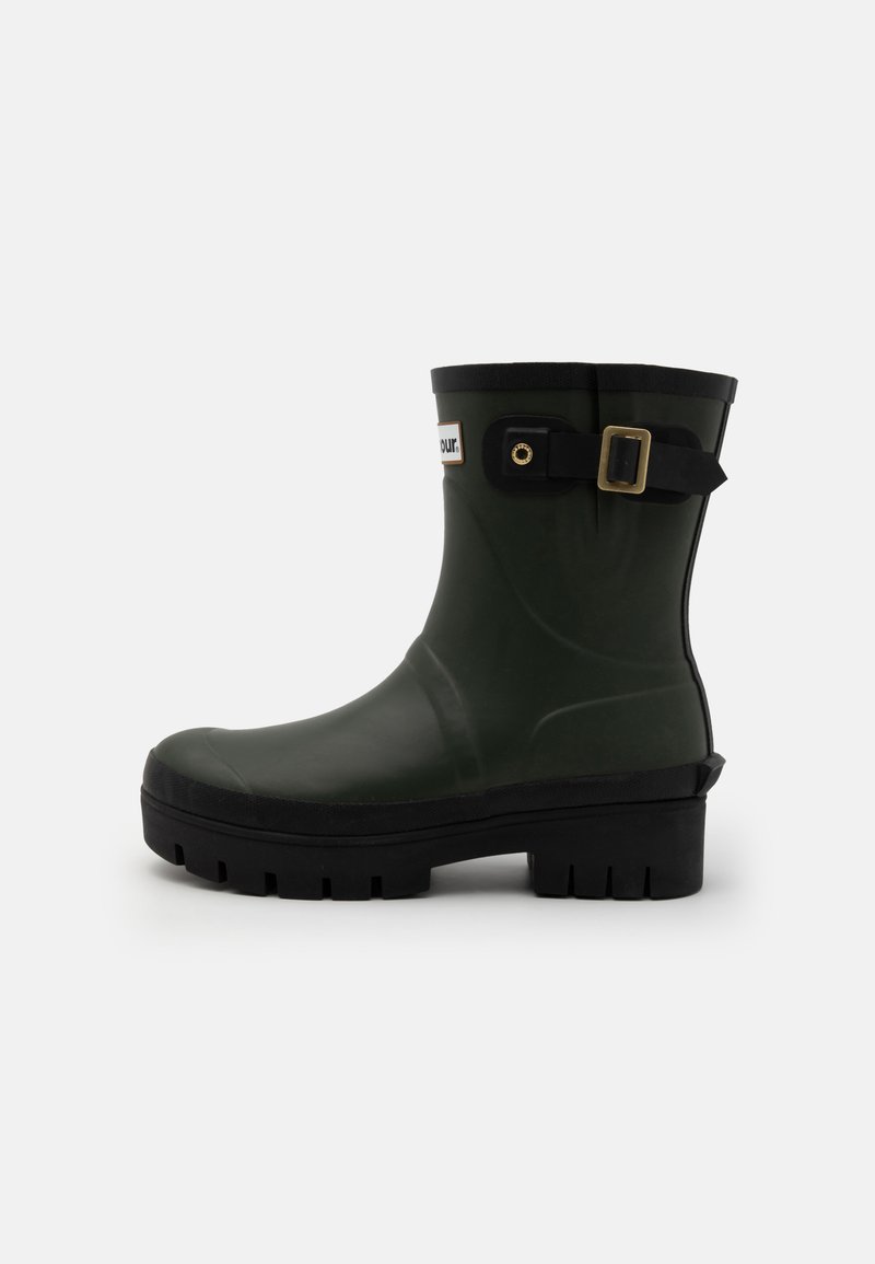 Green rubber ankle boot with a textured surface, black sole, and decorative black strap with a gold buckle. Features a brand label on the side.