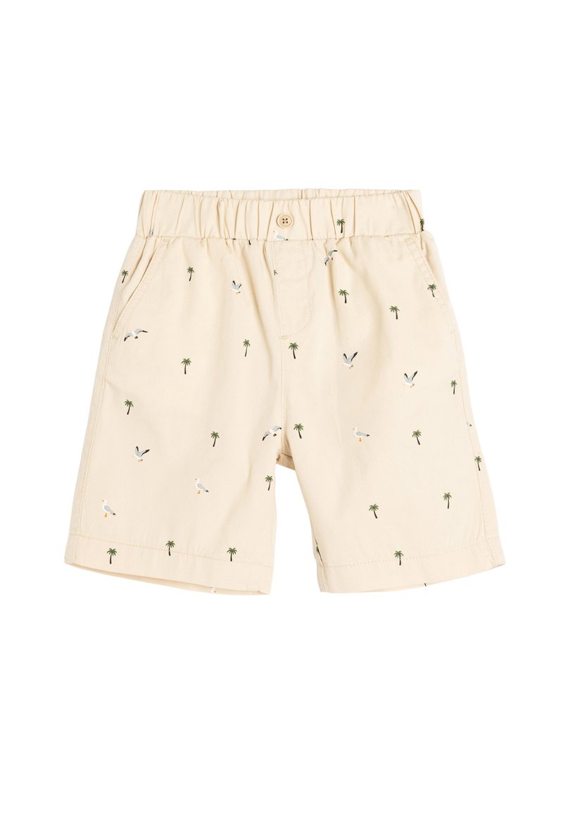 Beige Shorts mit einem elastischen Bund, die kleine gestickte Palmen und Vögel in Grün, Weiß und Orange im gesamten Stoff zeigen.