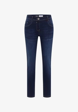 Jeans slim fit in denim blu scuro con tasche anteriori e posteriori, chiusura con bottoni e dettagli leggermente scoloriti su cosce e ginocchia.