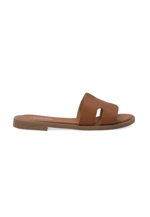 Brown leather slide sandal with a cut-out design, flat sole, and textured insole. Features light stitching along the edge.