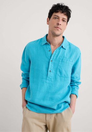 Lightweight turquoise linen shirt with a collared neckline, three buttons, long sleeves, and a front chest pocket.