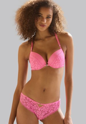 Pink lingerie set featuring a padded bra with lace overlay and adjustable straps. The brief includes a cutout detail and scalloped edges.