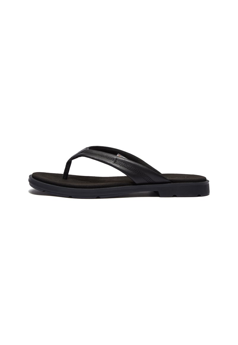Black flip-flop featuring a soft-textured rubber sole and sleek synthetic straps. The design includes minimal hardware and a low profile.