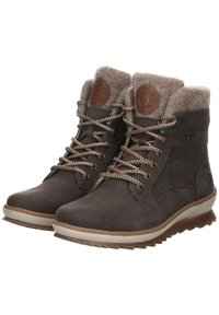 Brown leather ankle boots feature a soft wool collar, metal eyelets, and contrasting laces. The sole is textured with a rugged pattern for grip.