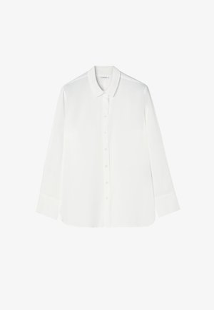 Valge pika varrukaga särg, mis on valmistatud siledast kangast, sisaldab nööpidega esiosa, klassikalist kraed ja ümarat alapoolt koos mansetiga varrukatega.