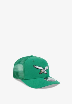 Green mesh baseball cap with embroidered white eagle holding a football on the front panel and a curved brim.