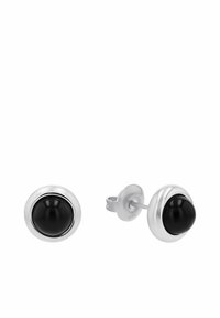 Pendientes de plata de studs con piedras negras redondas, rodeadas por un marco de plata suave, con un cierre de enhebrado simple.