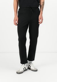 Jack & Jones JPSTACE NEO PANTS - Trousers - black
