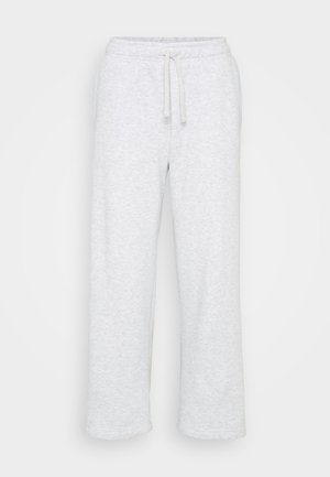 Lys grå bomullssweatpants med elastisk midje og snøring, rett benkutt, ingen synlige logoer eller mønstre.