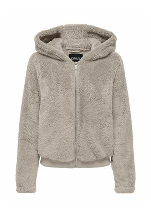 Haut à capuche zippé en fausse fourrure beige clair avec une capuche doublée, des poignets et un ourlet côtelés, et une texture douce. Étiquette de marque visible à l'intérieur.