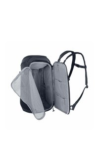 Zaino nero con scomparto principale aperto, caratterizzato da fodera grigia, tasche in rete e spallacci regolabili per una maggiore praticità.