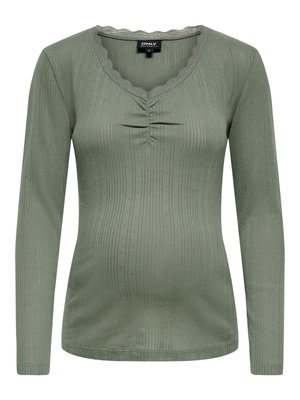 Groen top met lange mouwen en geribbelde textuur, met een geschulpte halslijn, een geraffineerd detail aan de voorkant en dunne metalen draadjes door de hele stof.