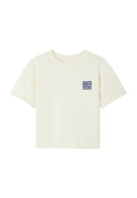 T-shirt à manches courtes couleur crème en tissu doux. Présente un petit logo "American Vintage" bleu sur la partie gauche de la poitrine. Coupe classique.