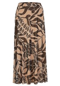 Jupe midi évasée en tissu léger, présentant un fond beige avec de grands motifs de feuilles marron et blanches. Taille élastique pour le confort.