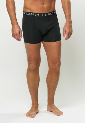 Schwarze Boxershorts mit einem U.S. Polo Assn. Logo am Bund. Hergestellt aus einem glatten Material, mit einem figurnahen Schnitt und mittelhoher Taille.