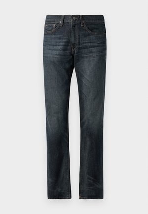 Tumed sinised denim teksad sirge lõikega, klassikalise viie-tasku disainiga ja vasest tikanditega aktsentidega.