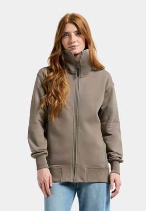 Jasnobrązowa bluza na zamek z wysokim kołnierzem, ściągaczami na mankietach i dole, z przednimi kieszeniami i gładką fakturą.