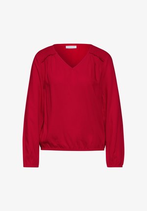 Rote Bluse mit langen Ärmeln, V-Ausschnitt, gerafftem Schulterdetail und elastischem Saum. Glattes Material mit leicht glänzender Textur.