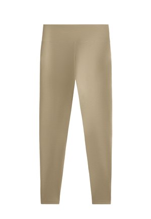 Leggings beige realizzati in tessuto texturizzato con un design aderente. La vita è elastica con una finitura liscia, che si restringe fino alle caviglie.