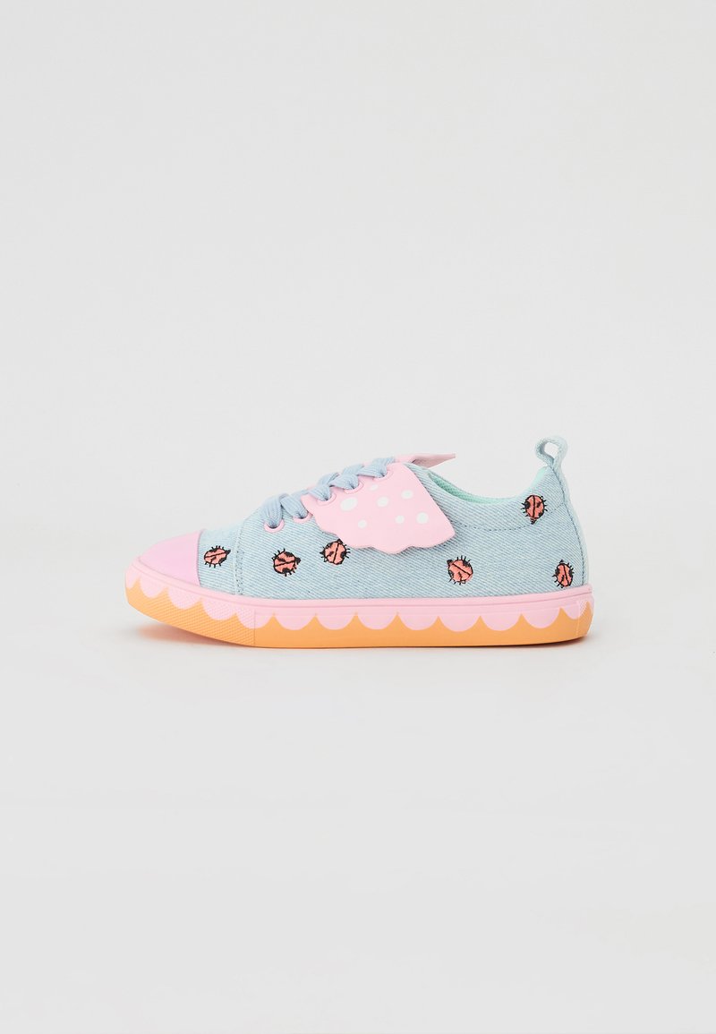 Light blue denim sneakers with pink and orange accents, scalloped sole, and polka dot detail. Features embroidered designs of lips.