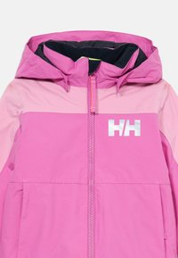 Ružová dvojfarebná vonkajšia bunda s kapucňou, predným zipsom a reflexným logom "HH" na hrudi.