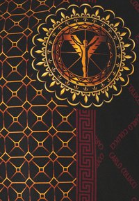 Black fabric with gold and orange geometric patterns, featuring a central emblem with a winged figure, and accented by a maroon border with text.