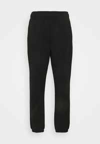 Pantaloni de trening negri, dintr-un material moale, cu talie elastică, picioare îngustate și manșete la gleznă, fără logo-uri sau modele vizibile.