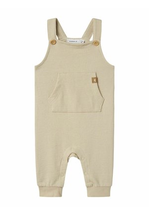 Bodysuit beige à côtes avec bretelles ajustables, boutons en bois, poche frontale et fermetures à pression au bas pour un habillage facile.