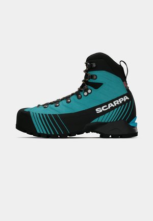 Blue and black hiking boot with high ankle, metal eyelets, patterned sole, and "SCARPA" logo on the side.