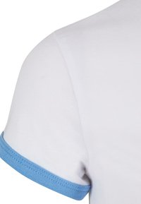 White cotton t-shirt featuring a blue ribbed cuff. The texture is smooth with a classic fit and simple design, focusing on basic color contrasts.
