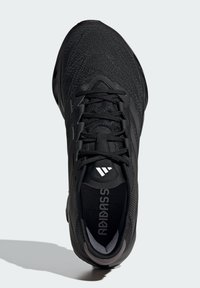 Black athletic shoe with a textured upper, flat laces, padded collar, and a lightweight design. Features a logo on the tongue and insoles.