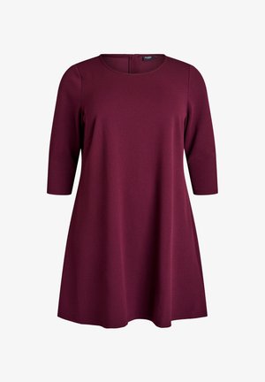 Burgundy knee-length dress in soft fabric with a round neckline and three-quarter sleeves. Features a subtle A-line silhouette and back zipper.