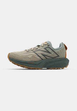 Lightweight athletic shoe with a textured beige upper, gray accents, and a green midsole. Features a rugged outsole for traction.