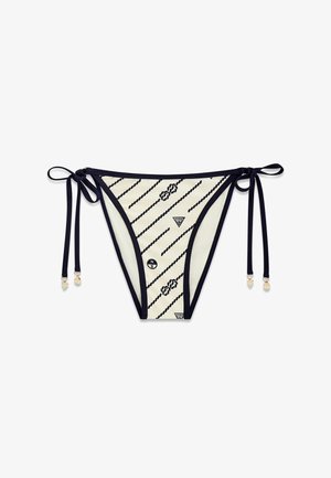 Bas de bikini rayé blanc et noir avec cordons latéraux, motifs de cordes nautiques et petits logos sur le tissu.
