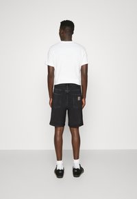 Carhartt WIP NEWEL MAITLAND - Shorts vaqueros - black stone washed