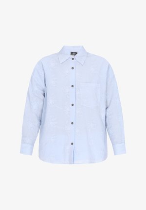 Svetlo modra srajca z dolgimi rokavi. Ima cvetlične vezenine, sprednji žep in sive gumbe. Mehak in prijeten material.