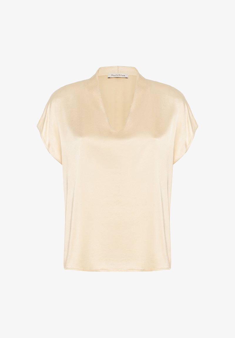 Blouse en satin à manches courtes de couleur crème clair, avec un décolleté en V et une coupe décontractée. Texture lisse et design minimaliste sans ornements.
