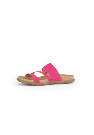 Pink slide sandal with two elastic straps, cushioned tan insole, and rubber outsole. Light texture and minimalistic design.