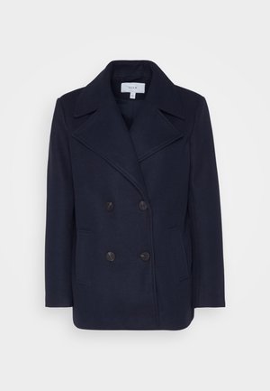 Navy wool double-breasted coat with large notched lapels, two front pockets, and black buttons. Smooth texture, structured fit.