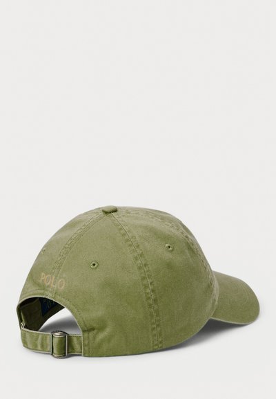 Olive green cotton cap with adjustable strap, featuring embroidered "POLO" text and a curved brim, showcasing a smooth texture.