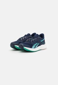 Pair of navy blue running shoes with teal accents, white midsoles, and green tread, displayed on a white background.