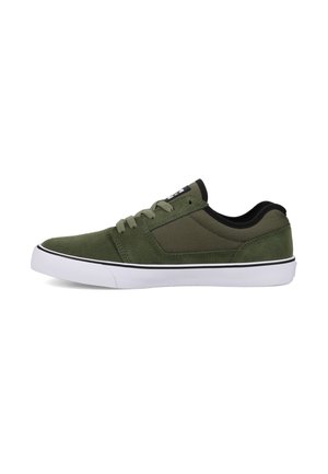 Green suede sneakers with black accents, featuring a low-top design, white rubber sole, and classic lace-up closure.